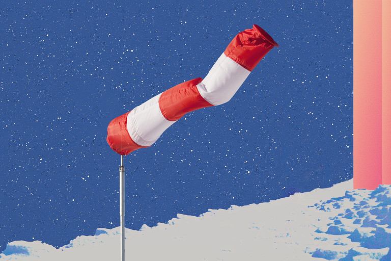A red and white wind sock mounted on a pole stands against a deep blue starry sky. The foreground features a snowy landscape with icy textures, while a gradient of pink light and abstract shapes appear on the right side, adding a surreal and atmospheric touch to the scene.